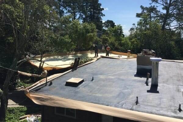 A flat roof being prepared before spray foam roofing is applied