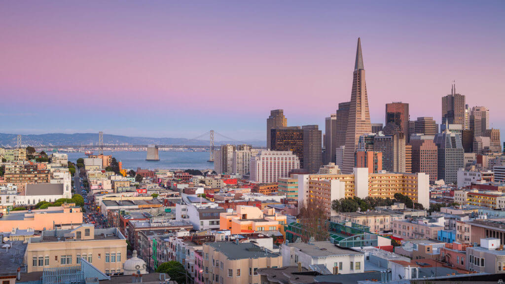 The Bay Area skyline with many flat roof buildings with foam roofing